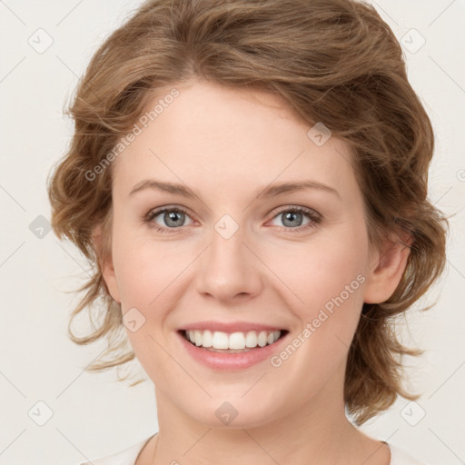 Joyful white young-adult female with medium  brown hair and green eyes