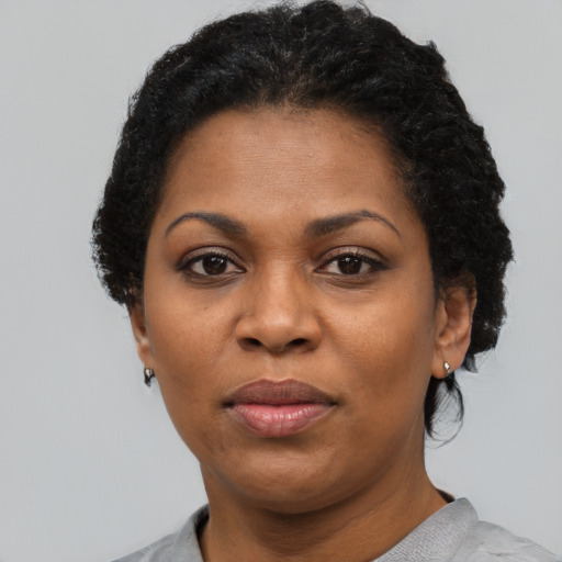 Neutral black adult female with short  black hair and brown eyes