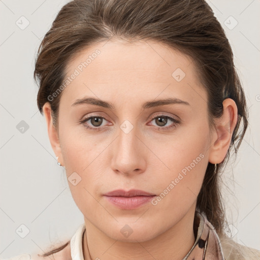 Neutral white young-adult female with long  brown hair and grey eyes