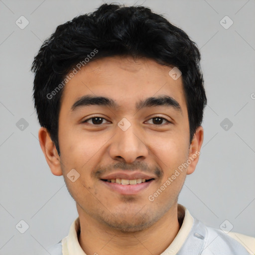 Joyful latino young-adult male with short  black hair and brown eyes