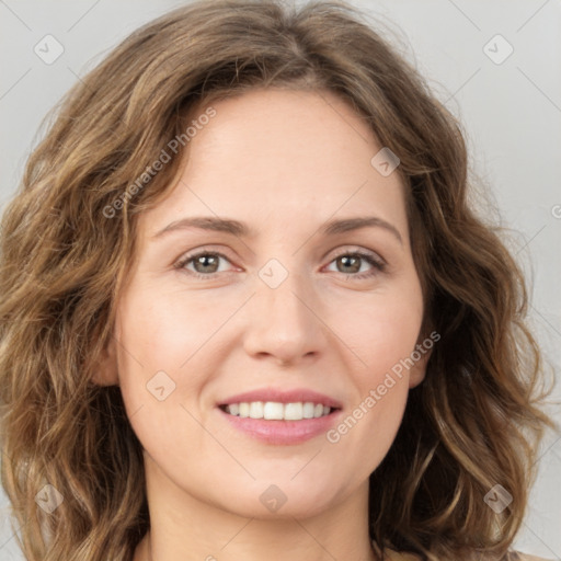 Joyful white young-adult female with long  brown hair and green eyes