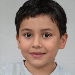 Joyful white child male with short  brown hair and brown eyes