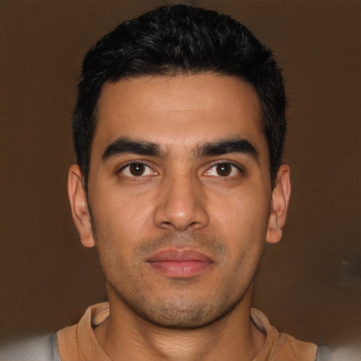 Neutral latino young-adult male with short  black hair and brown eyes