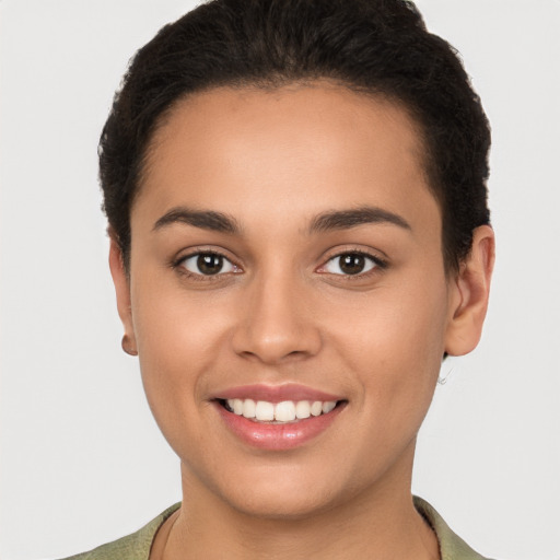 Joyful white young-adult female with short  brown hair and brown eyes