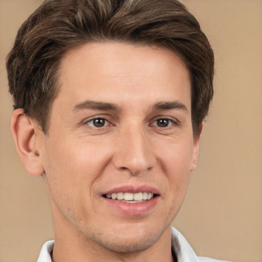 Joyful white adult male with short  brown hair and brown eyes