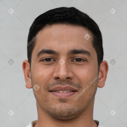 Joyful latino young-adult male with short  brown hair and brown eyes