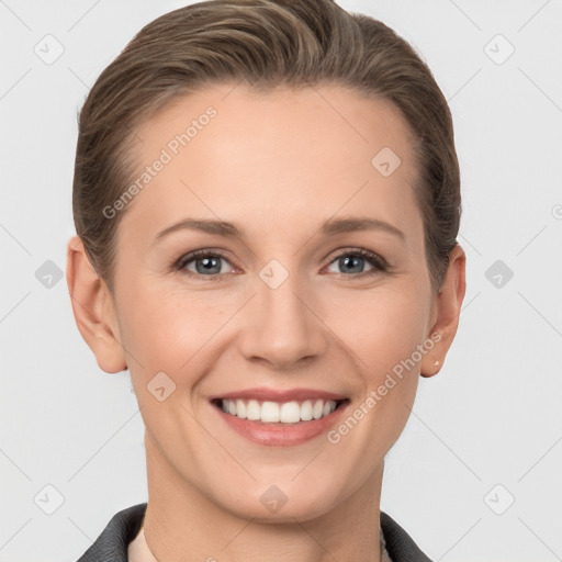 Joyful white young-adult female with short  brown hair and grey eyes