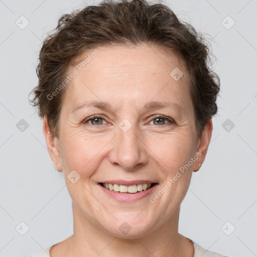 Joyful white adult female with short  brown hair and brown eyes