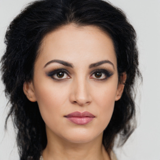 Neutral latino young-adult female with long  brown hair and brown eyes