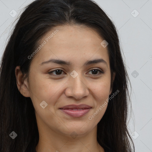 Joyful latino young-adult female with long  brown hair and brown eyes