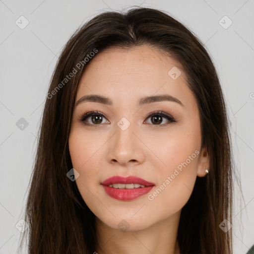 Joyful asian young-adult female with long  brown hair and brown eyes