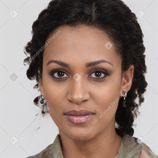 Joyful black young-adult female with long  black hair and brown eyes