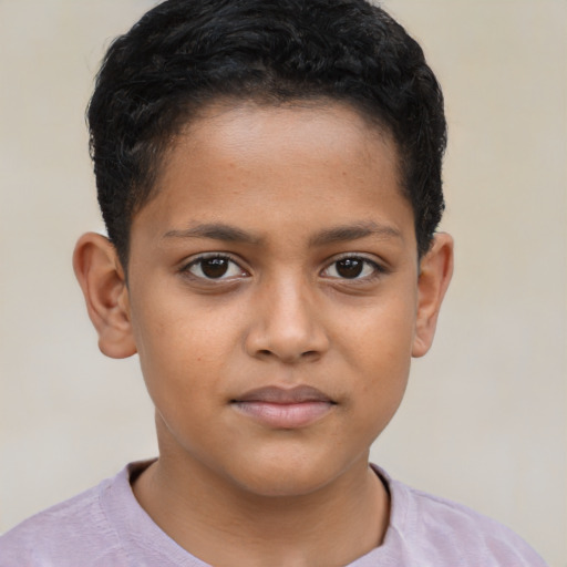 Joyful latino child male with short  brown hair and brown eyes