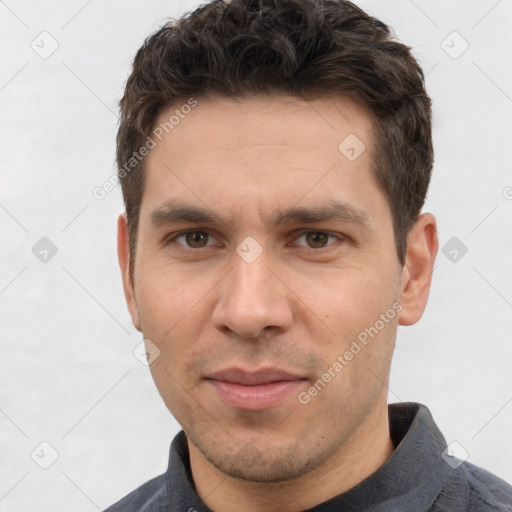 Joyful white adult male with short  brown hair and brown eyes