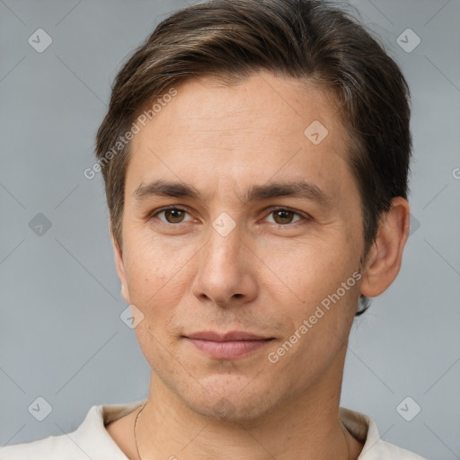 Joyful white adult male with short  brown hair and brown eyes