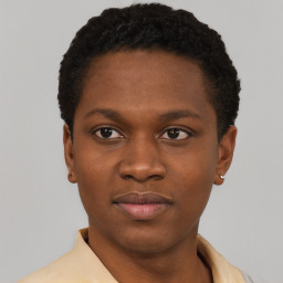 Joyful latino young-adult female with short  black hair and brown eyes