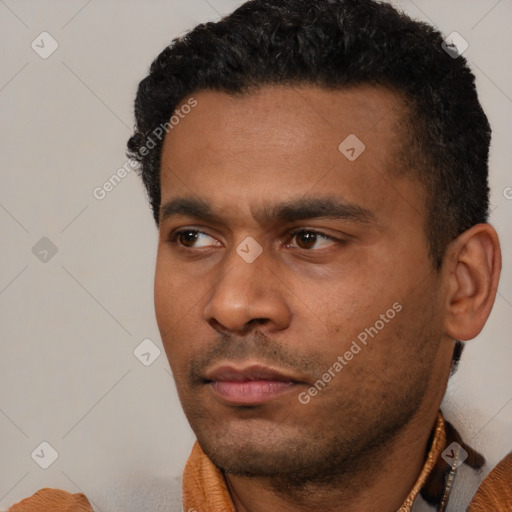 Neutral latino young-adult male with short  black hair and brown eyes
