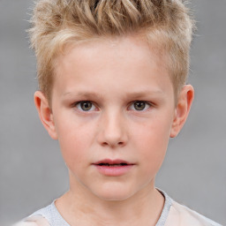 Child with grey eyes and brown hair, neutral expression