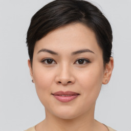 Joyful asian young-adult female with short  brown hair and brown eyes