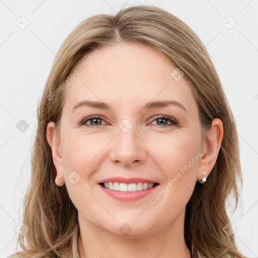 Joyful white young-adult female with long  brown hair and grey eyes