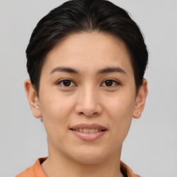 Joyful asian young-adult female with short  brown hair and brown eyes