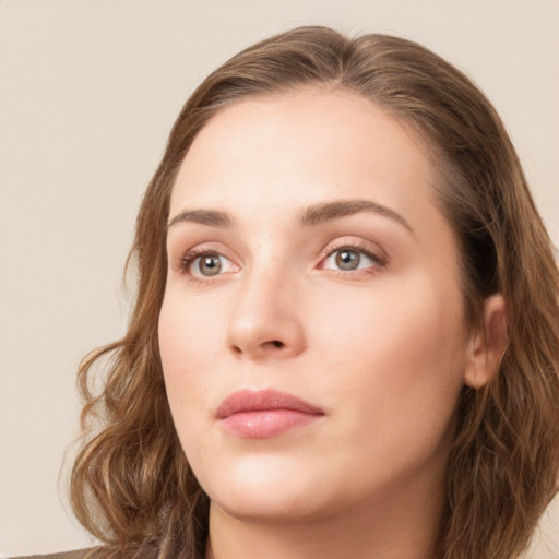 Neutral white young-adult female with long  brown hair and green eyes