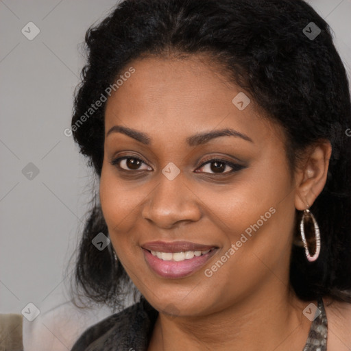 Joyful black young-adult female with long  brown hair and brown eyes