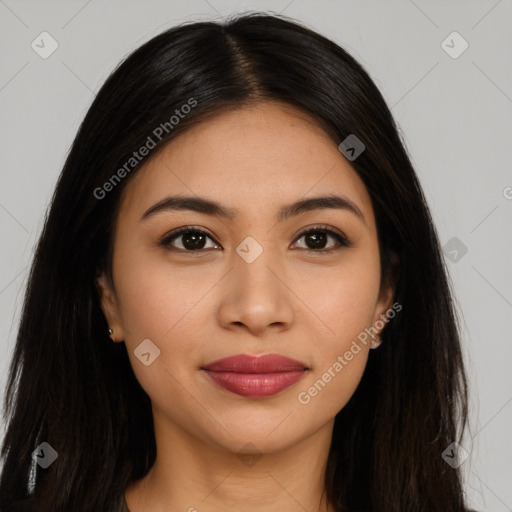 Joyful latino young-adult female with long  brown hair and brown eyes