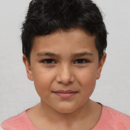 Joyful white child male with short  brown hair and brown eyes