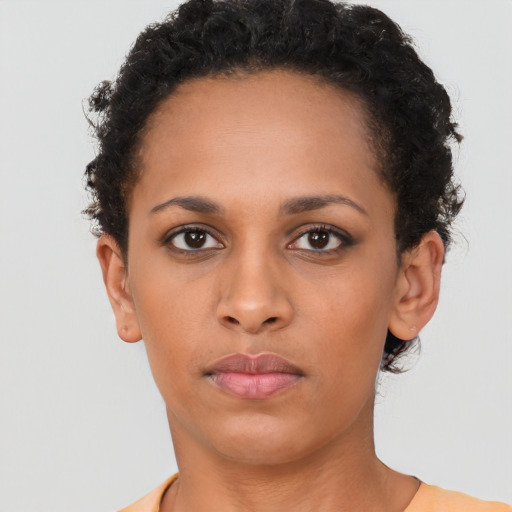 Neutral black young-adult female with short  brown hair and brown eyes