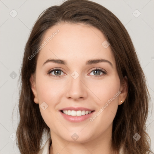 Joyful white young-adult female with long  brown hair and green eyes