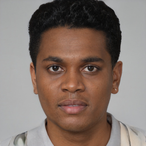 Neutral black young-adult male with short  black hair and brown eyes