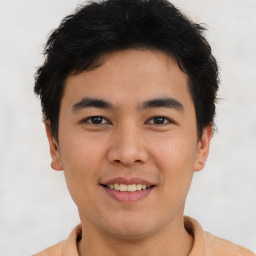 Joyful asian young-adult male with short  brown hair and brown eyes