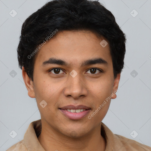 Joyful latino young-adult male with short  brown hair and brown eyes