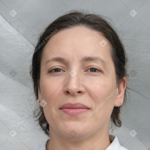 Joyful white adult female with medium  brown hair and brown eyes