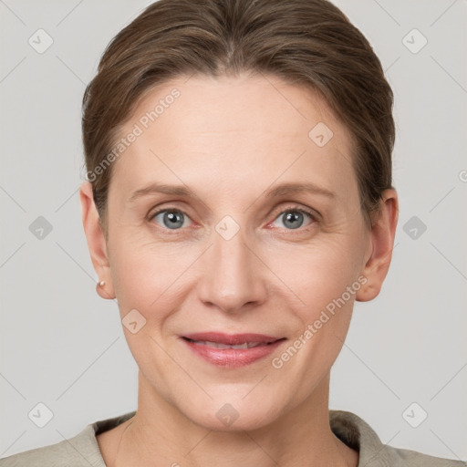 Joyful white adult female with short  brown hair and grey eyes