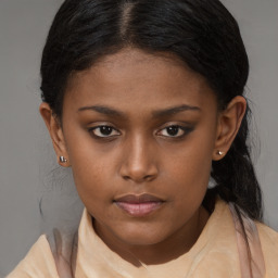 Neutral black young-adult female with medium  brown hair and brown eyes