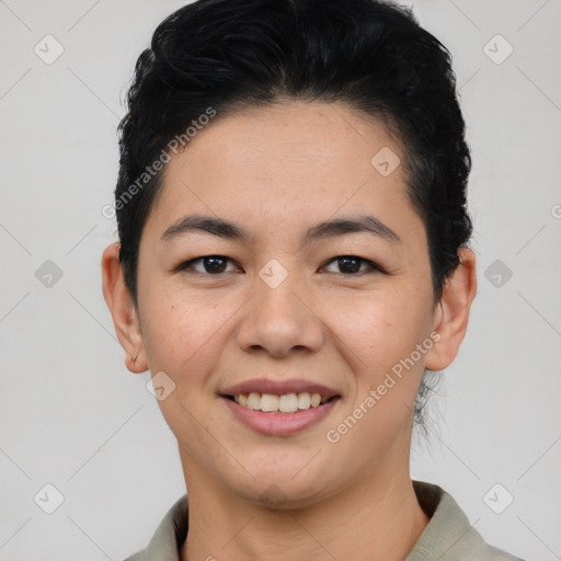 Joyful asian young-adult female with short  black hair and brown eyes