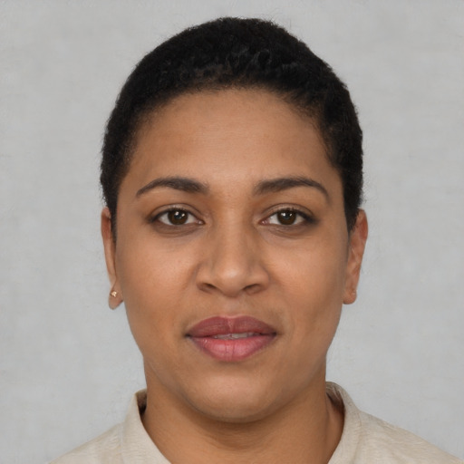 Joyful latino young-adult female with short  brown hair and brown eyes
