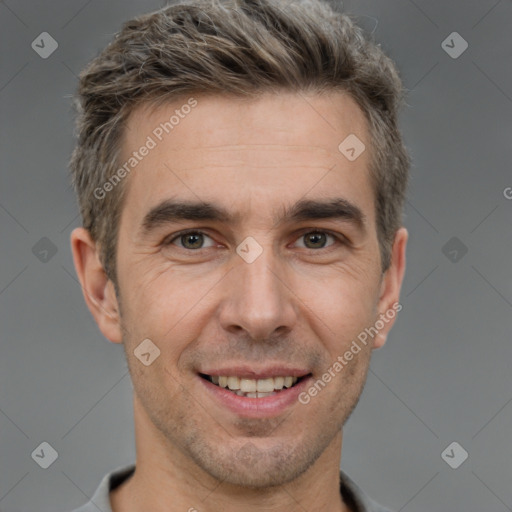 Joyful white adult male with short  brown hair and brown eyes