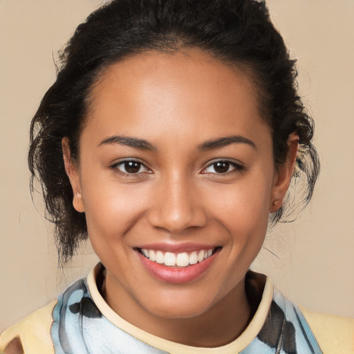 Joyful latino young-adult female with medium  brown hair and brown eyes