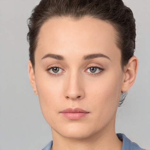 Neutral white young-adult female with short  brown hair and brown eyes