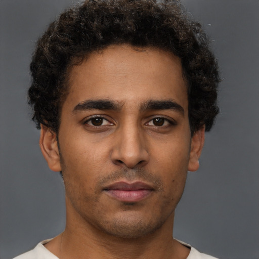 Neutral latino young-adult male with short  brown hair and brown eyes