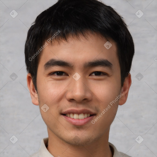 Joyful asian young-adult male with short  brown hair and brown eyes