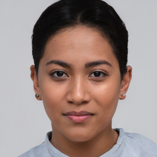 Joyful asian young-adult female with short  black hair and brown eyes