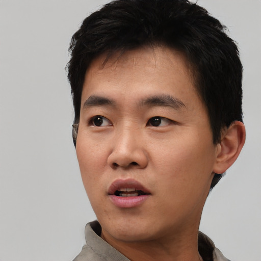 Neutral asian young-adult male with short  black hair and brown eyes
