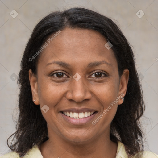 Joyful latino adult female with medium  brown hair and brown eyes