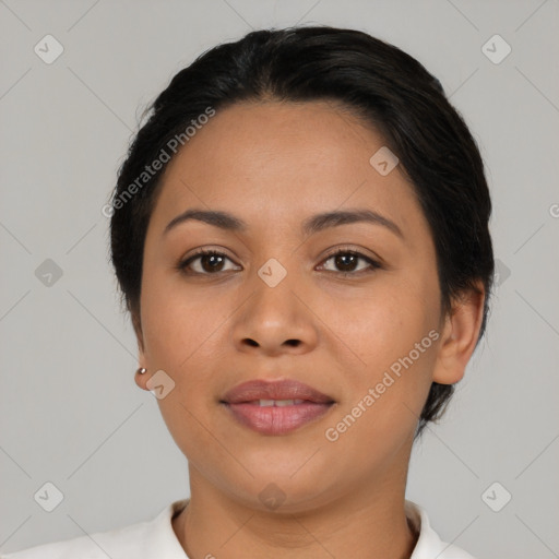 Joyful latino young-adult female with short  black hair and brown eyes