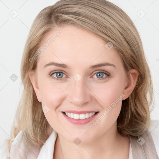 Joyful white young-adult female with medium  brown hair and blue eyes