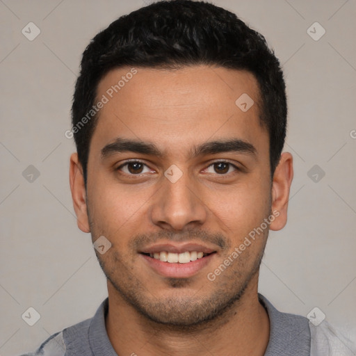 Joyful white young-adult male with short  black hair and brown eyes